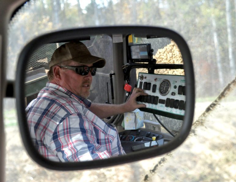 Kevin Grass steers a 15-ton potato harvester through potato fields at Grass Farms in Blaine on Sept. 29. An ongoing drought has caused his potato yields to be down a third this year. Photo by Katie Brown.