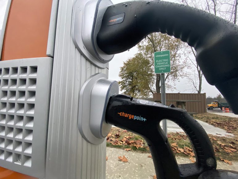 <em>A Level 2 electric vehicle charger, like this one at the Kennebunk service plaza off of I-95 North, provides about 25 miles of range per hour of charge. Without adequately spaced chargers along travel routes, battery range can be a concern for drivers, particularly when it’s reduced by cold temperatures or highway speeds. Photo by Fred J. Field.</em>