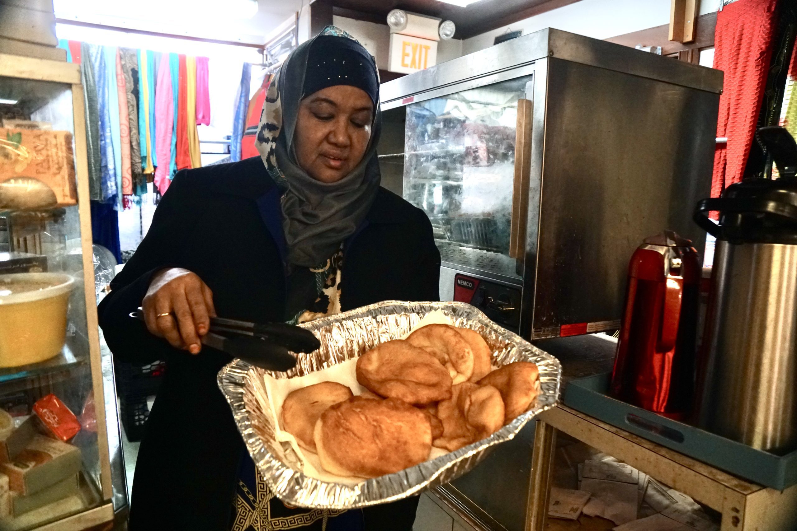 Shukri Abasheikh displays bur, a Somali bread she makes and sells at the Mogadishu store in Lewiston. Photo by Hannah Rafkin.