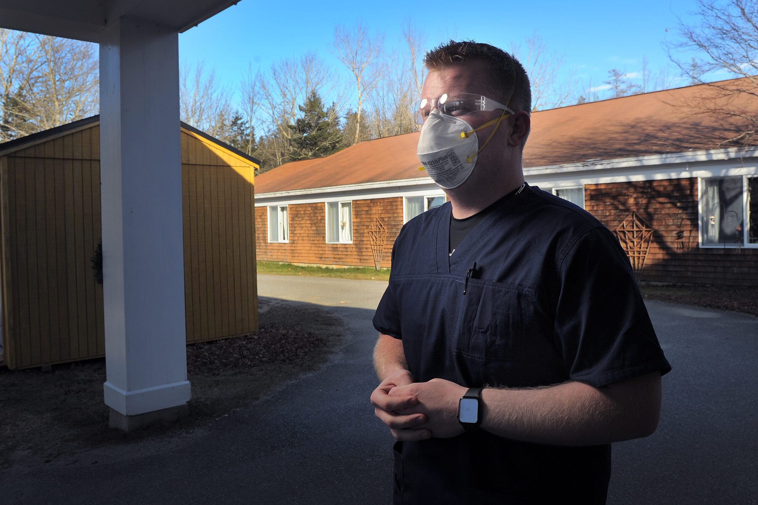 Matt Trombley standing outside the Island Nursing Home on Deer Isle to discuss COVID-19