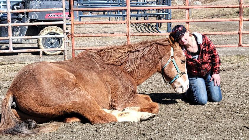 Kelly McIver with her horse Stitch after her son's suicide