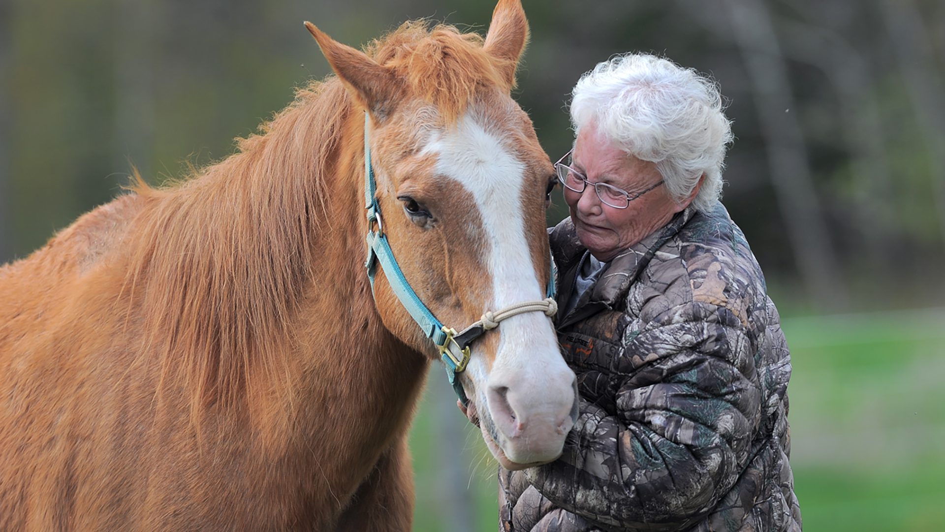 Rhonda McIver with her daughters horse Stitch after Kellys overdose