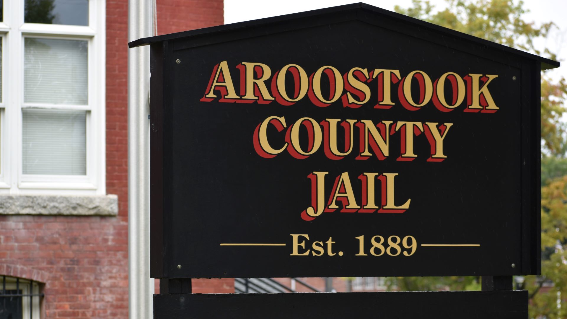 Sign outside Aroostook County Jail that reads Aroostook County Jail, Established 1889