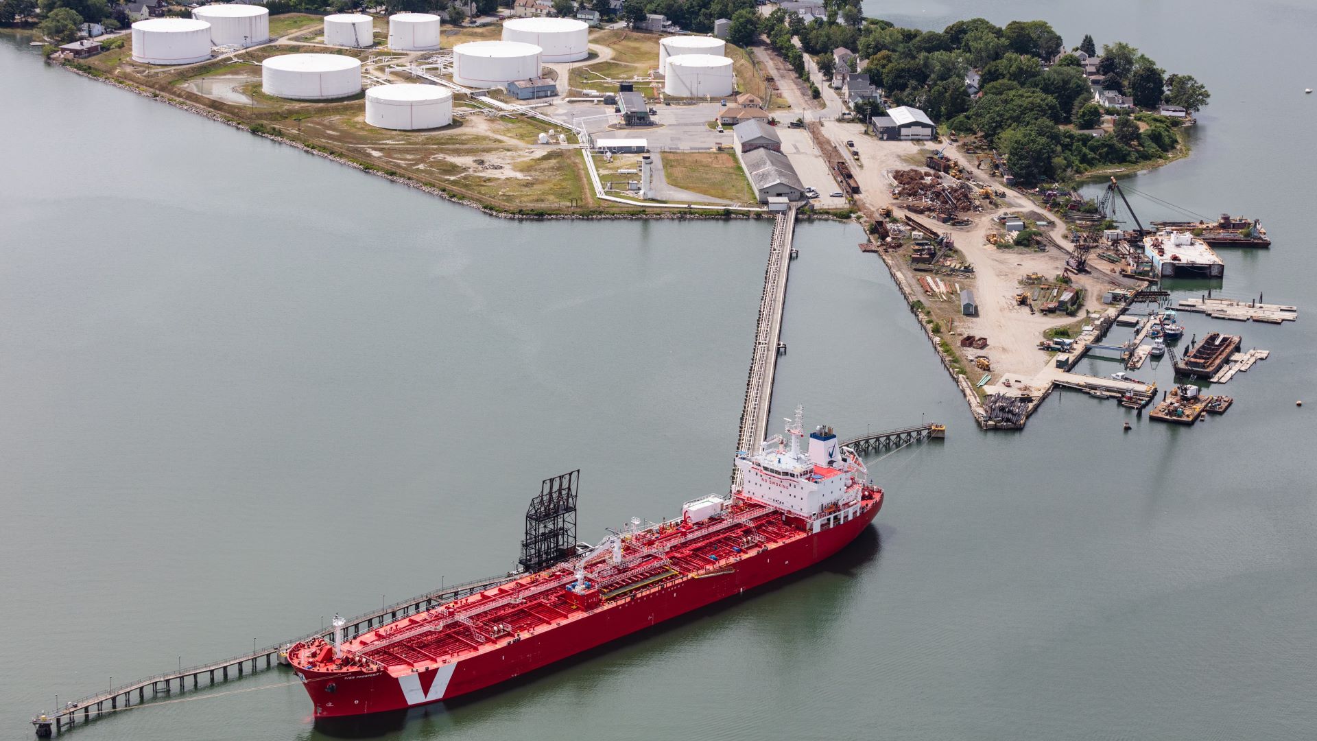 A red oil tanker near the petroleum tanks of South Portland