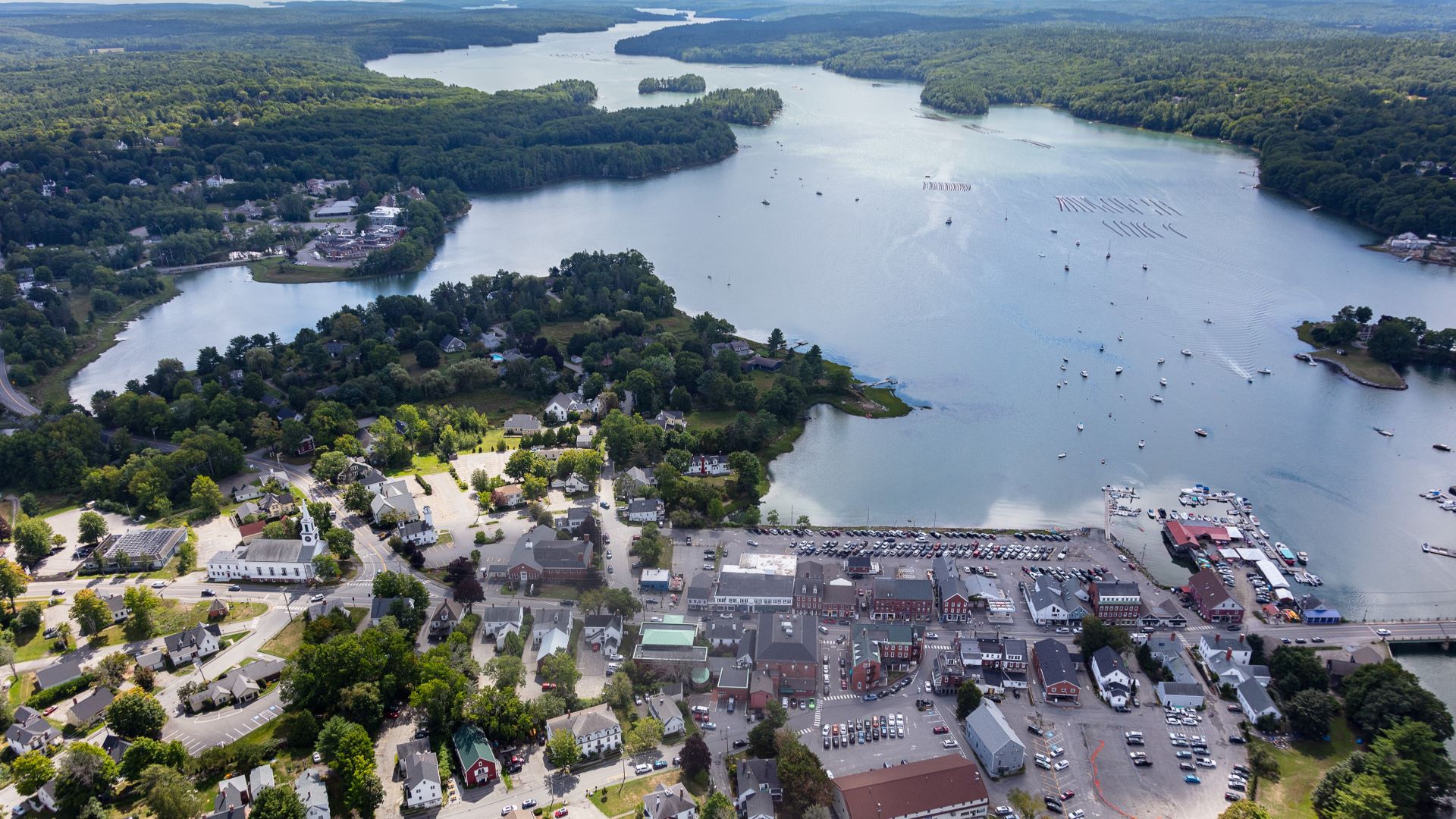 Aerial view of a parking lot in Damariscotta and homes that are at risk of being washed away