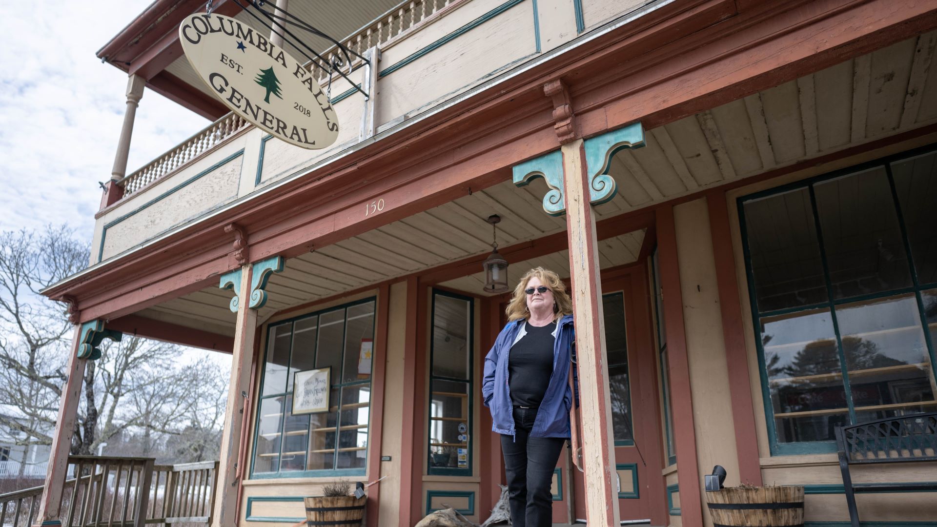 Nancy Bailey posts for a photo outside the Columbia Falls General Store.